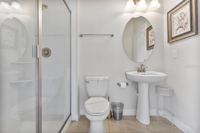 bathroom with toilet, an enclosed shower, and tile patterned flooring