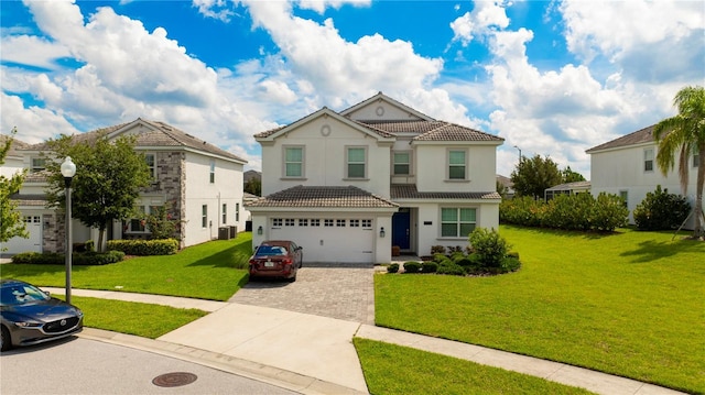 mediterranean / spanish house with a garage and a front yard