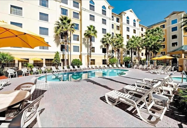 view of swimming pool featuring a patio