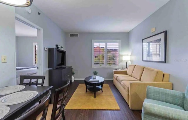 living room featuring dark hardwood / wood-style floors