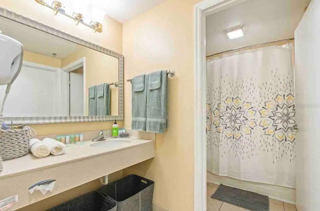 bathroom with sink and tile flooring