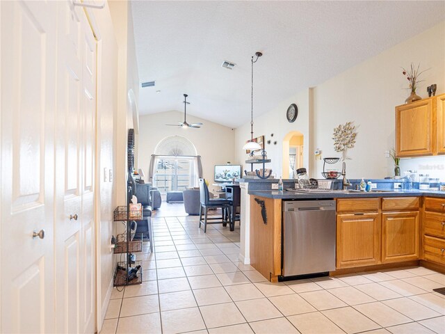 kitchen featuring pendant lighting, dishwasher, lofted ceiling, ceiling fan, and light tile patterned floors