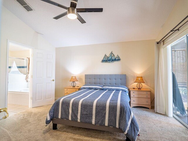 carpeted bedroom with access to exterior, connected bathroom, vaulted ceiling, and ceiling fan