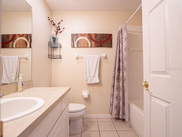 full bathroom with a textured ceiling, vanity, shower / bathtub combination with curtain, tile patterned flooring, and toilet