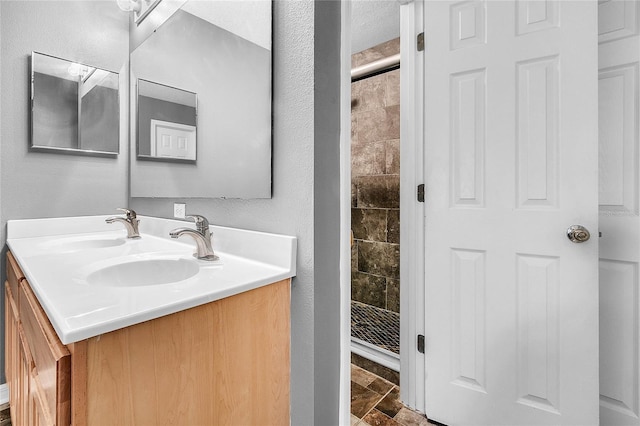 bathroom featuring vanity and walk in shower