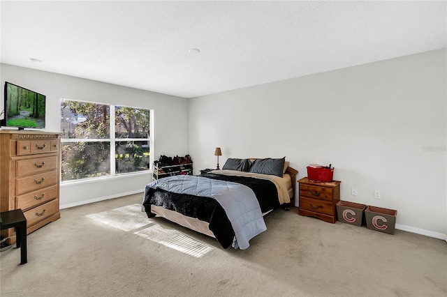 bedroom with light carpet