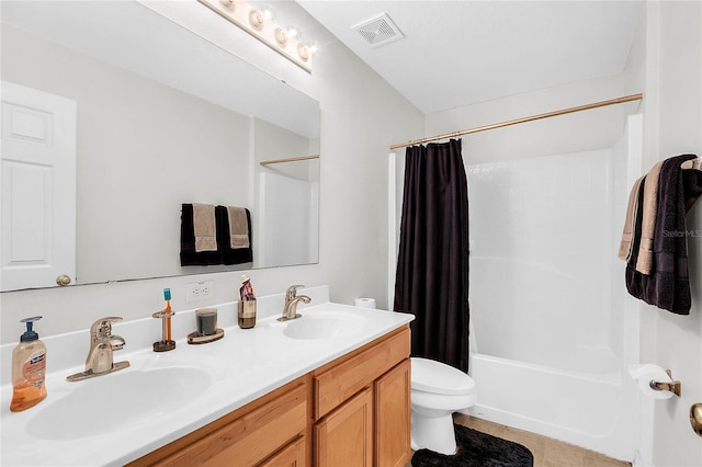 full bathroom with tile patterned flooring, shower / bath combination with curtain, vanity, and toilet