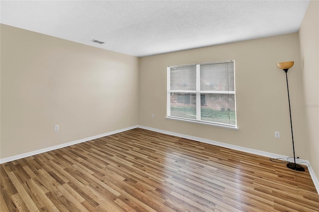 unfurnished room featuring light wood-type flooring