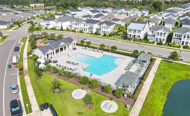 birds eye view of property with a water view