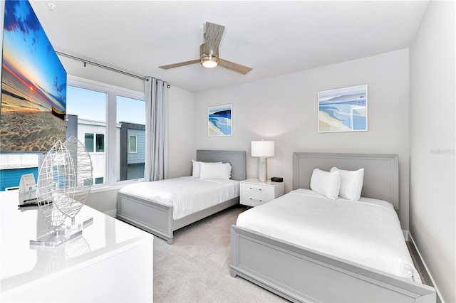 bedroom featuring light carpet and ceiling fan