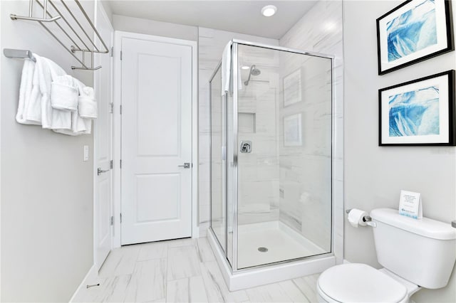 bathroom featuring toilet, tile patterned floors, and walk in shower