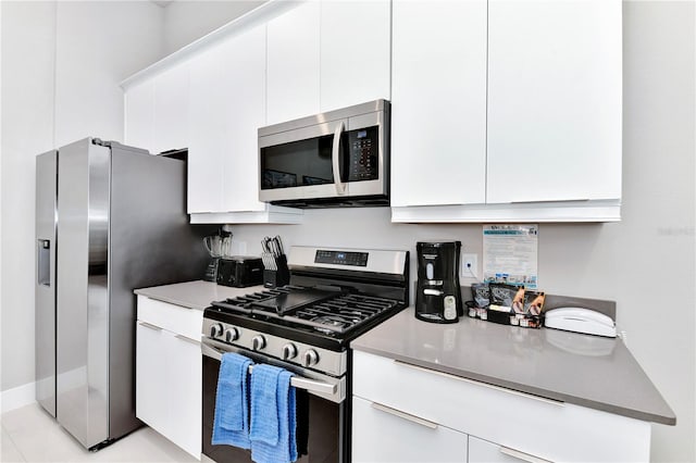 kitchen featuring white cabinetry and stainless steel appliances