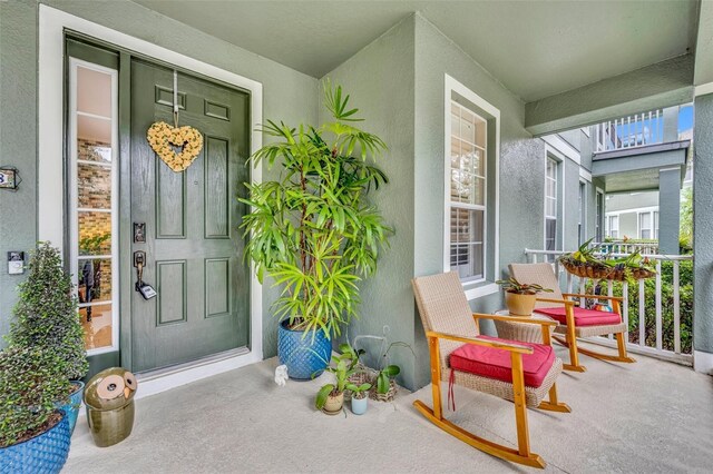 property entrance with covered porch