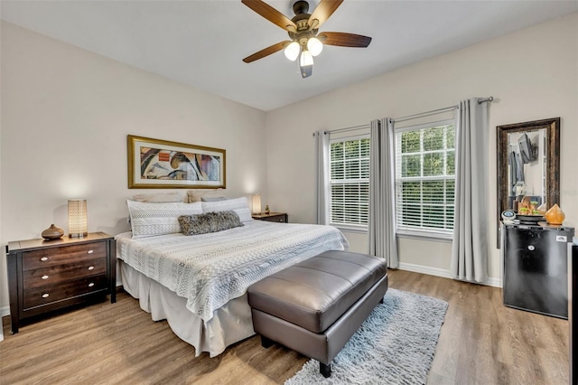 bedroom featuring light hardwood / wood-style flooring and ceiling fan