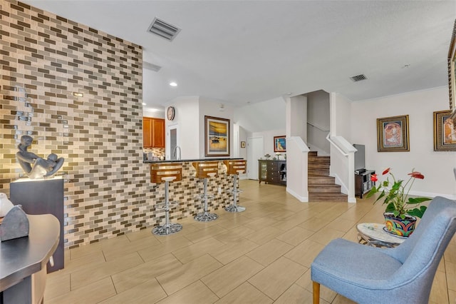 living room featuring crown molding