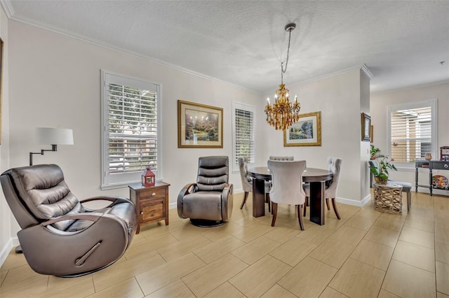 dining area featuring an inviting chandelier, ornamental molding, and a textured ceiling