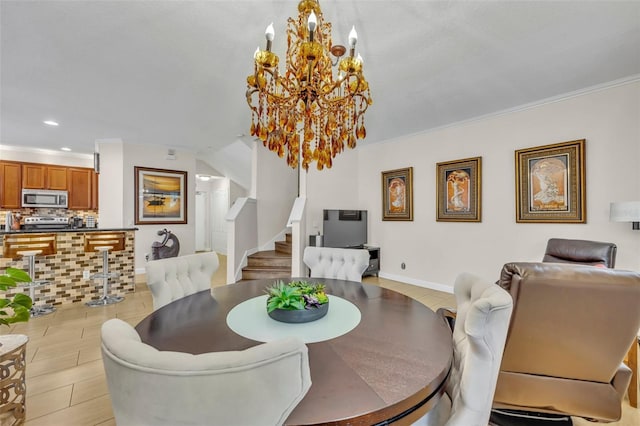 dining area with ornamental molding and a chandelier