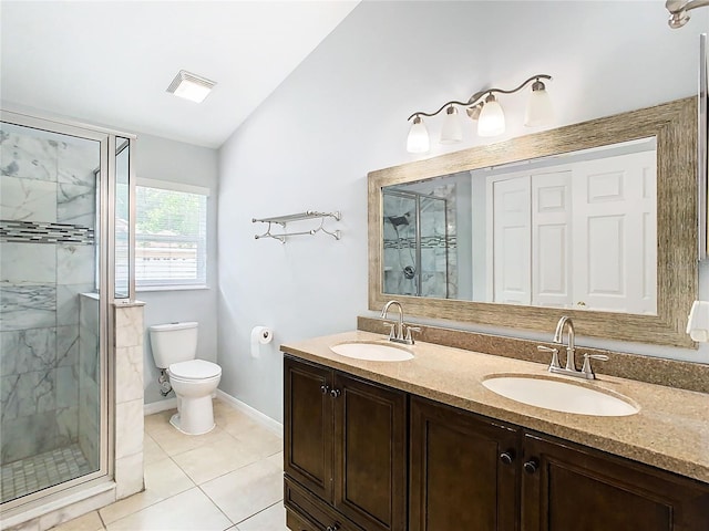 bathroom featuring vanity, a shower with door, vaulted ceiling, tile patterned flooring, and toilet