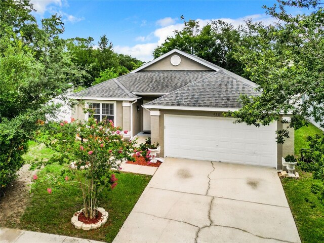 single story home featuring a garage