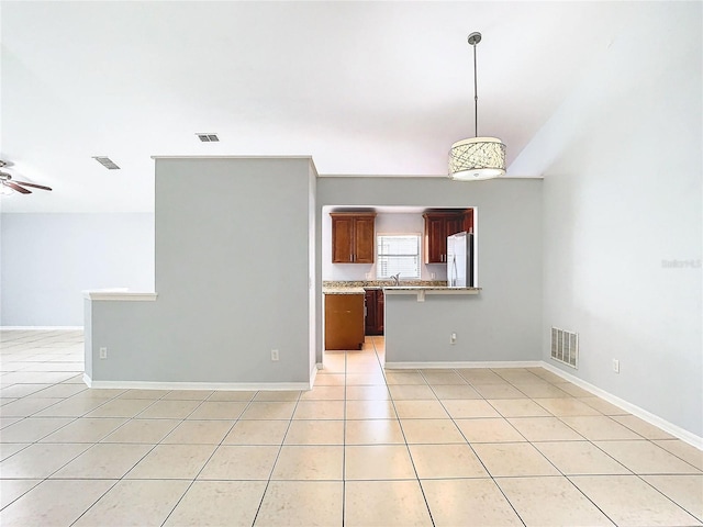 tiled spare room with ceiling fan and sink