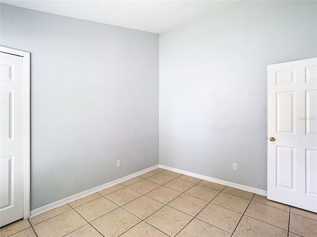 unfurnished room with light tile patterned floors