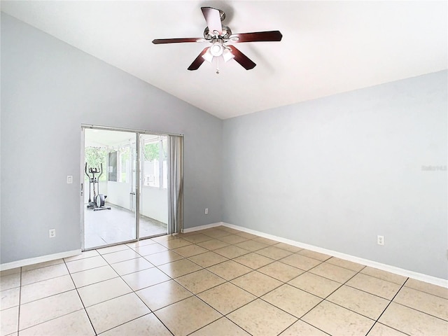 tiled spare room with vaulted ceiling and ceiling fan