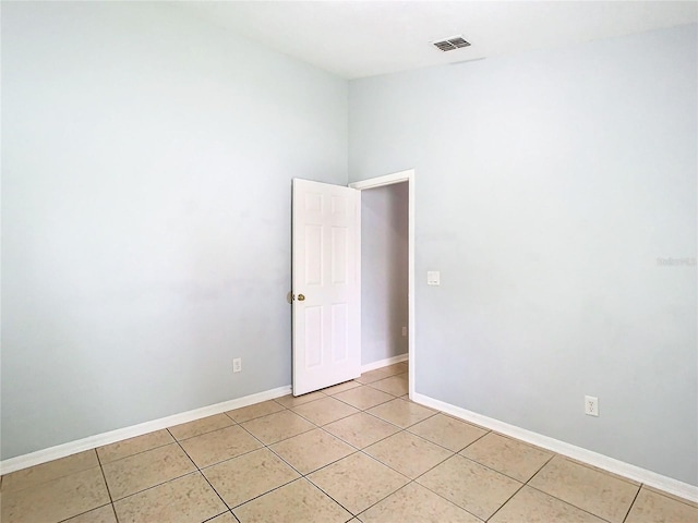 spare room with light tile patterned floors