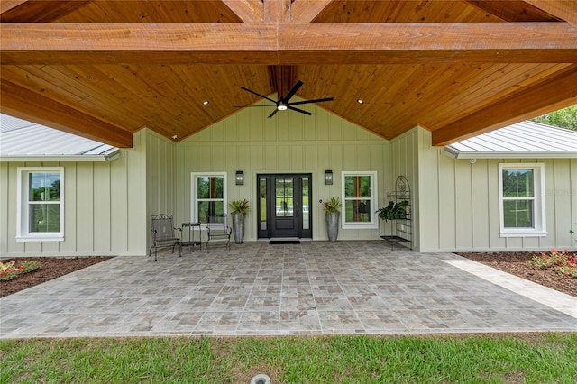 entrance to property featuring ceiling fan and a patio