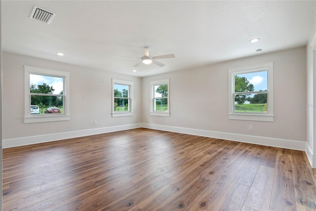 unfurnished room featuring dark hardwood / wood-style floors and ceiling fan