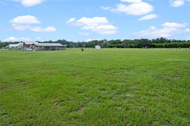 view of yard with a rural view