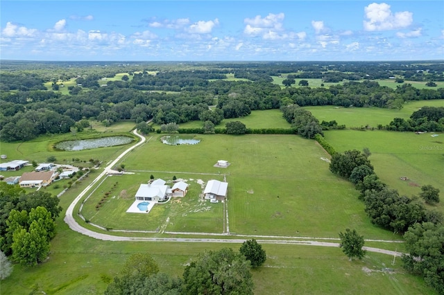 birds eye view of property with a rural view and a water view