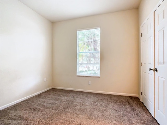 unfurnished bedroom featuring carpet