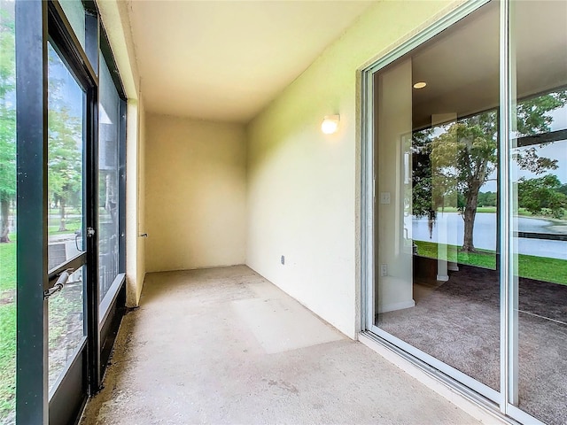 unfurnished sunroom featuring a wealth of natural light