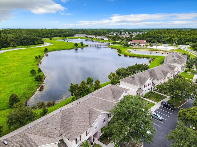 birds eye view of property with a water view