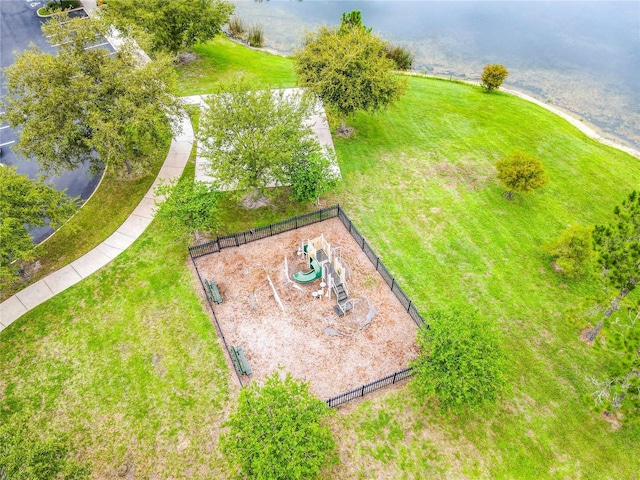 birds eye view of property with a water view