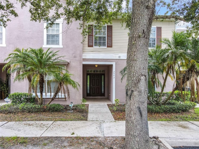 2543 Old Kent Cir, Kissimmee, FL 34758 - view of front facade with stucco siding