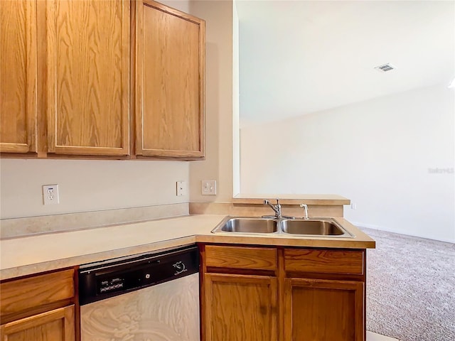 2543 Old Kent Cir, Kissimmee, FL 34758 - kitchen with stainless steel dishwasher, a sink, carpet, a peninsula, and light countertops