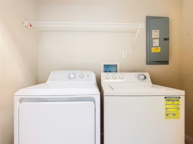 2543 Old Kent Cir, Kissimmee, FL 34758 - laundry area with electric panel and separate washer and dryer