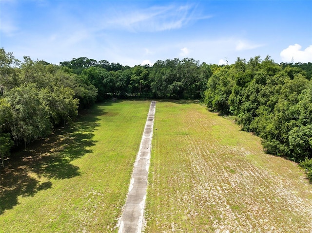 birds eye view of property with a rural view