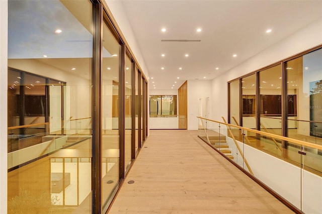 hall with light hardwood / wood-style floors