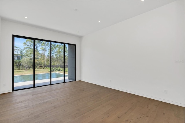 spare room featuring light wood-type flooring