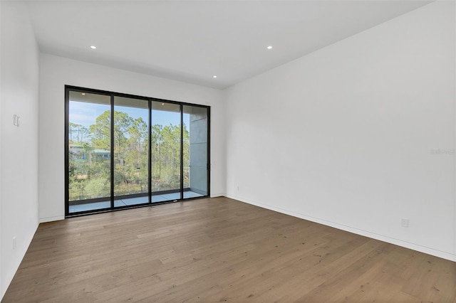 unfurnished room featuring light hardwood / wood-style floors