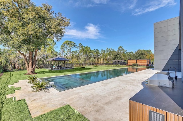 view of swimming pool with a lawn, area for grilling, a patio, and a gazebo