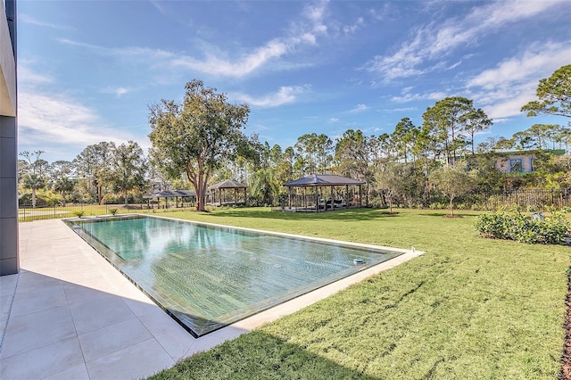 view of pool with a lawn and a gazebo