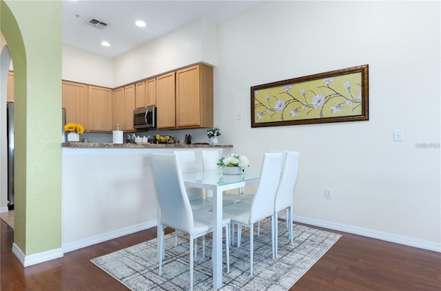 dining room featuring dark hardwood / wood-style floors