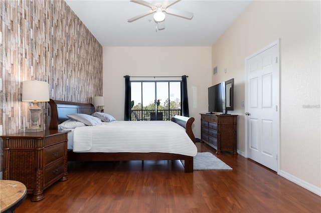 bedroom with access to exterior, ceiling fan, and dark wood-type flooring