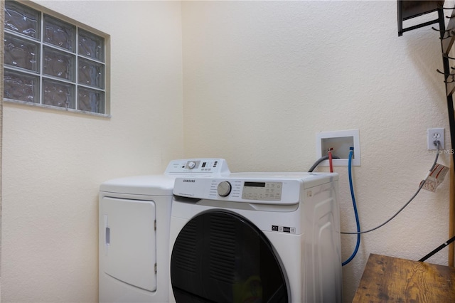 washroom with washer and dryer