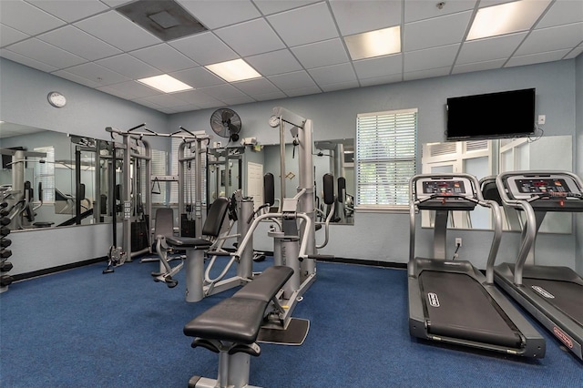 workout area with a paneled ceiling