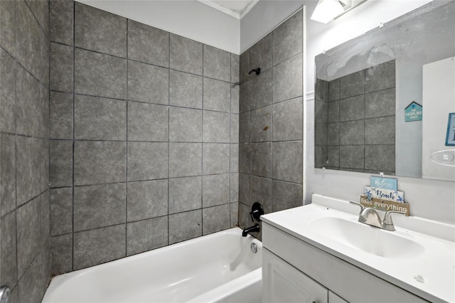 bathroom with vanity and tiled shower / bath combo