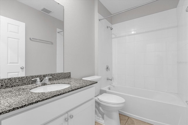 bathroom with tile patterned flooring, visible vents, tub / shower combination, toilet, and vanity